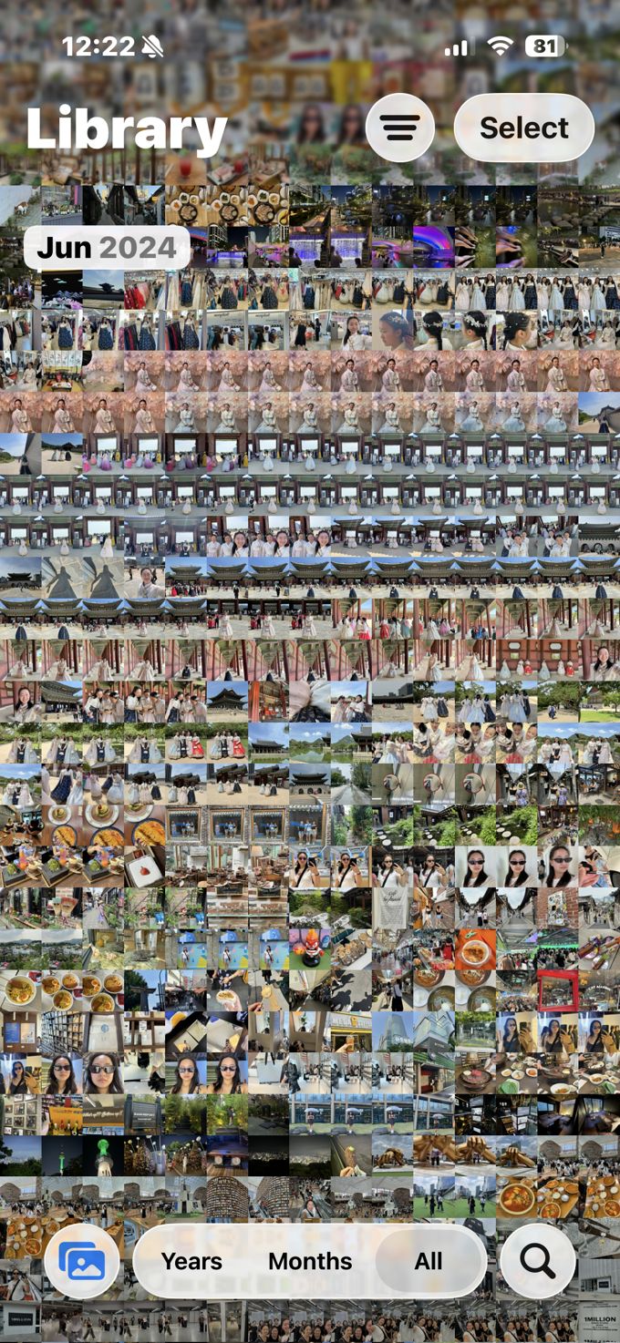 A single trip's iOS camera roll — a dense, blurred grid of hundreds of unsorted travel photos